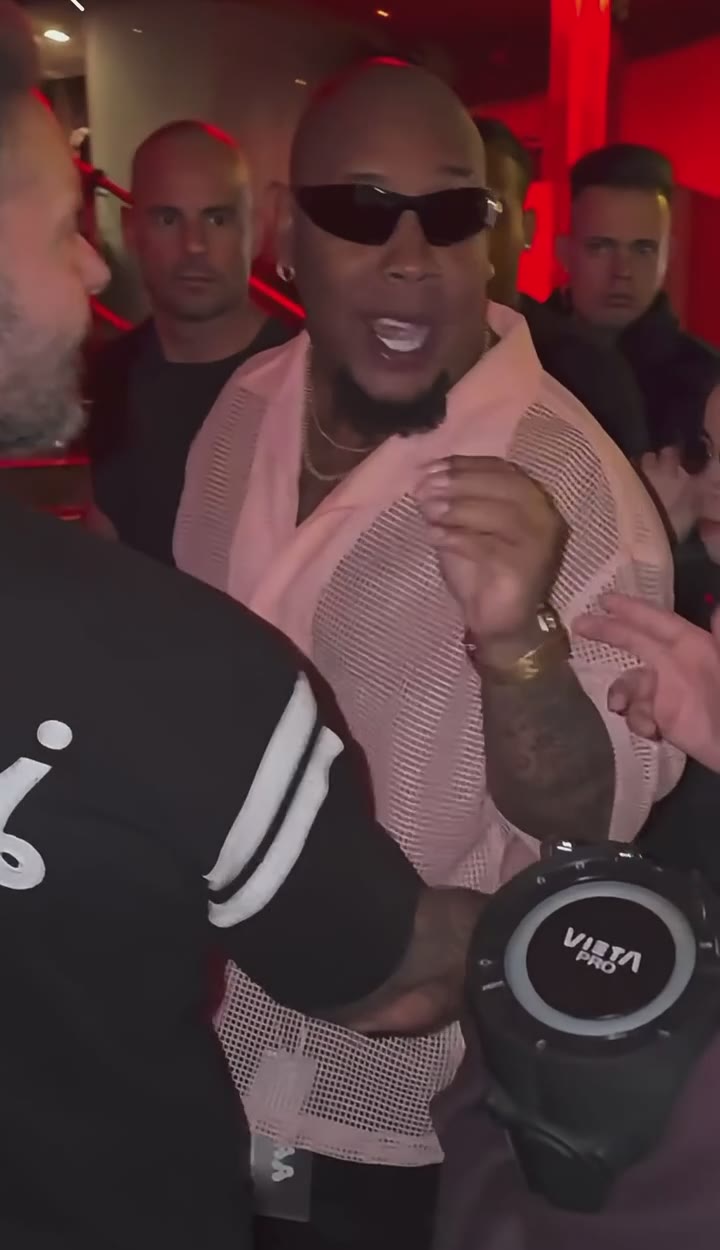 Bulin 47 AI example: a rapper in shades freestyles in a red-lit club while a friend holds up a speaker