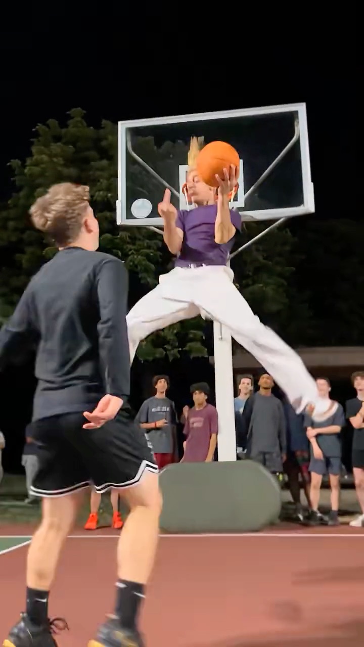 Middle Finger Dunk AI example: a player with bleached spiky hair dunks on a defender at a night court